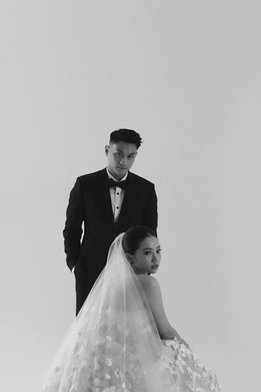 Matthew standing behind Karin in her veil